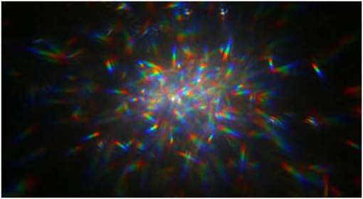 Orbiting Rainbows- polvo brillante- luz- láser- telescopio-